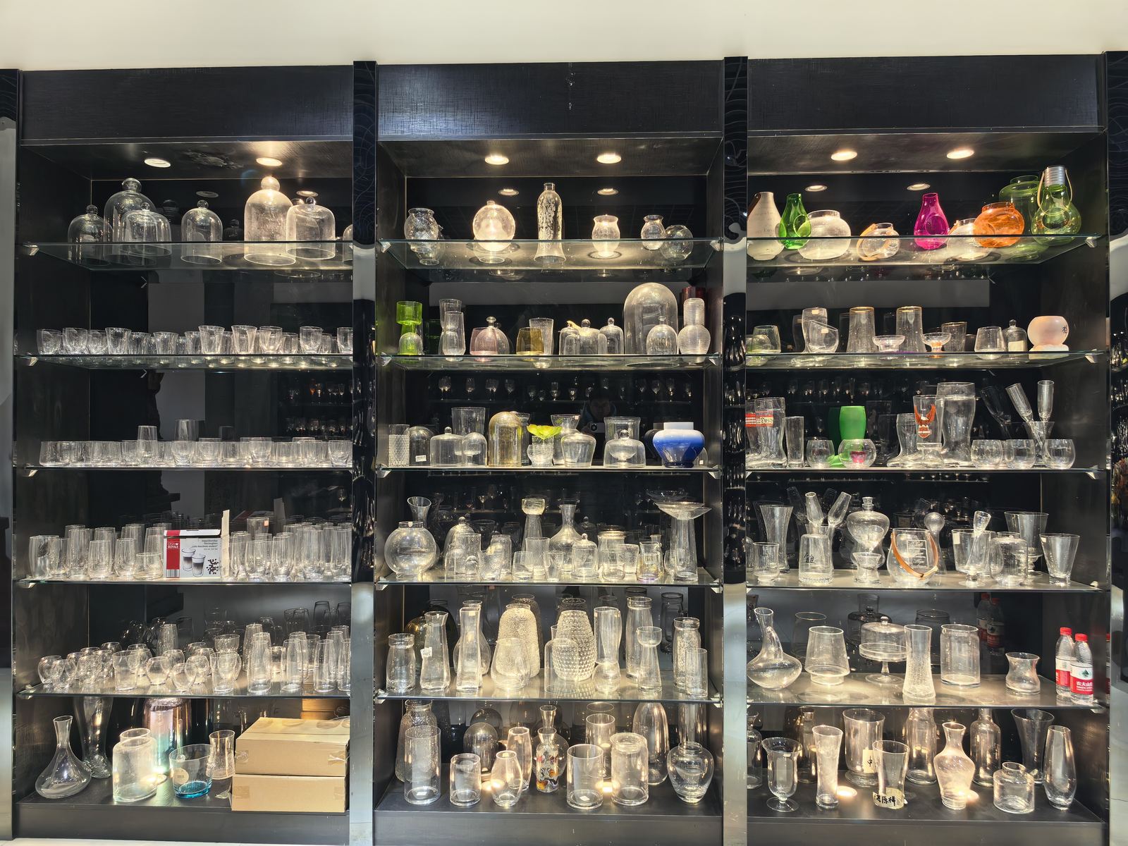 Glass domes, colored glass pieces, and decorative glassware